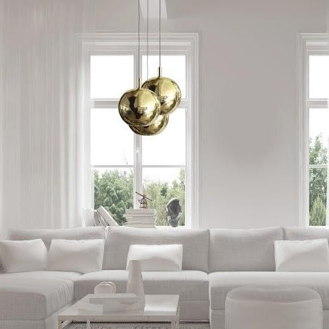White living room with brass pendant lights