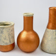 Marble and copper vases in different shapes
