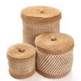 Three woven lidded baskets in different sizes