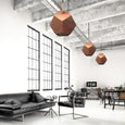 Modern office with copper geometric pendant lights