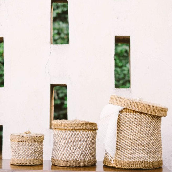 Three woven lidded baskets