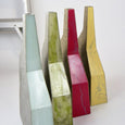 Four geometric vases in different colours