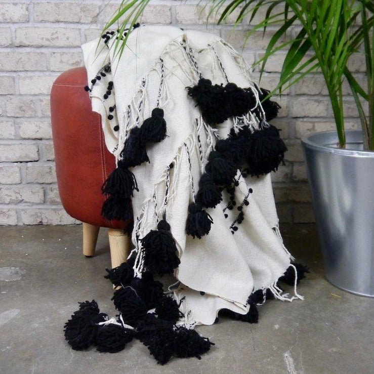 Black and white textured blanket on a stool