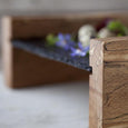 Close up of a slate and wood sharing platter